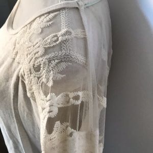 Jolt cream top with sheer shoulder and back